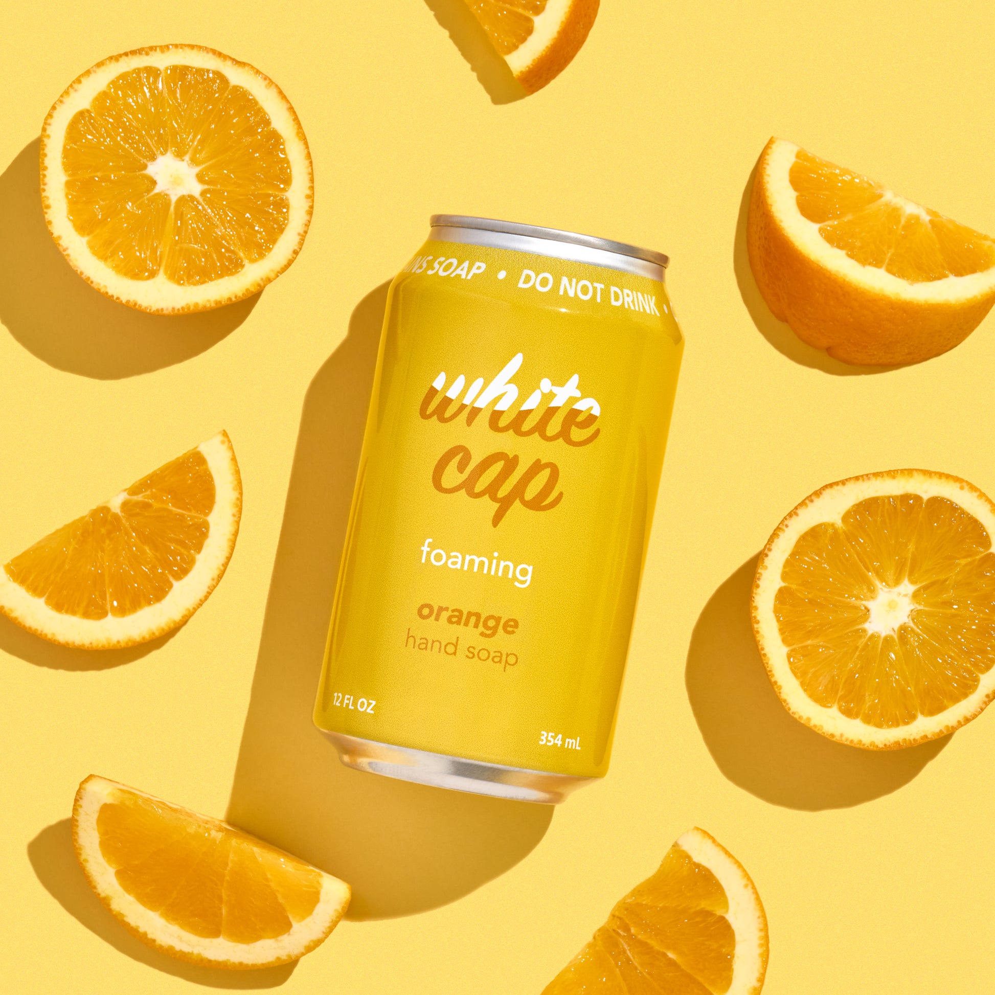 White Cap foaming orange hand soap in recyclable aluminum can.