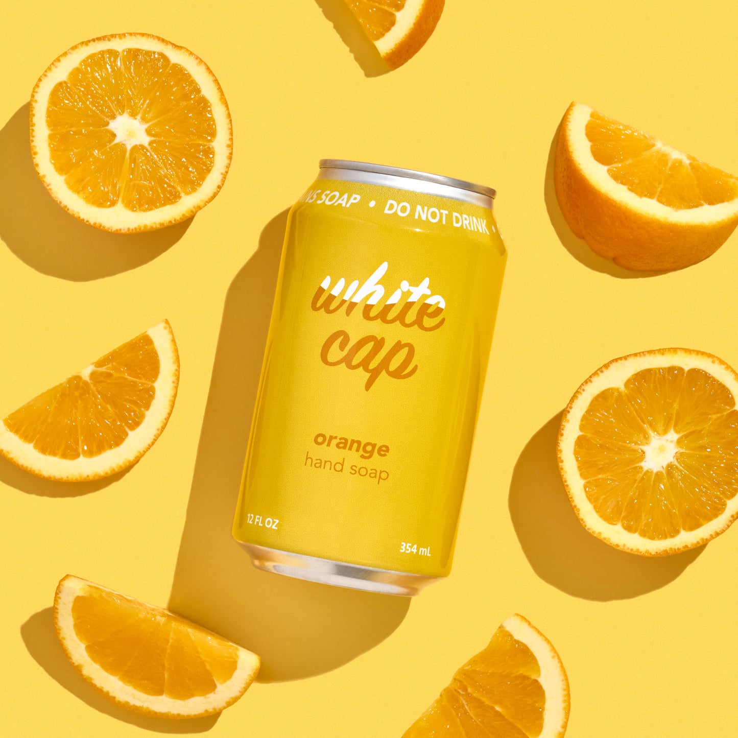 White Cap liquid orange hand soap in recyclable aluminum can.